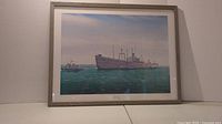 Framed print showing the full artwork of Protector's Final Voyage featuring a large ocean vessel under a partly cloudy sky, with calm greenish-blue waters.