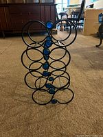 Front view showing infinity loop design and blue glass accents