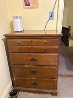 Front view showing drawer arrangement and hardware