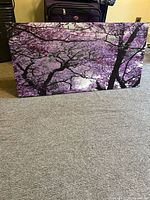 Front view of canvas showing purple cherry blossom tree design