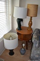 Group of four lamps showing shades and bases