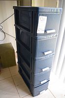 Full view of blue plastic 5-drawer storage unit