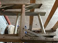 Close-up photo of the ladder rungs and structural braces showing material and usage marks.