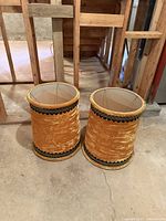 Pair of golden velvet lamp shades with black decorative trim, approximately 22 inches tall, placed on floor.