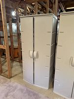 Two cabinets side by side showing exterior with closed doors