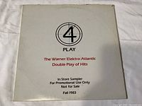 Front view of 4 Play LP record cover with logo and release information from Fall 1983.