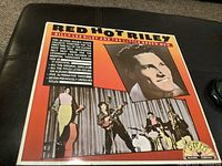 Front cover of the album showing the title, artist name, promotional sticker, and portrait of Billie Lee Riley with the band performing.