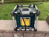 View of front side showing Bosch power box with two yellow outlets, power cord and frame structure