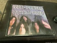 Front cover of Deep Purple Machine Head LP record showing embossed silver text and band photo