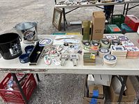 Photo showing broad selection of Labatt's branded items including ice buckets, coasters, keychains, and boxed coaster holder