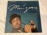 Front cover of the Charles Mingus 'Mingus' album on Candid label, showing stylized title, artist photo, and stereo marking.