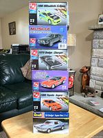 Stack of six car model kits showing titles and box art