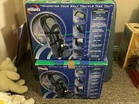 Two Alien travel golf bags in original boxes stacked, showing brand and features on packaging including durable construction and padded protection