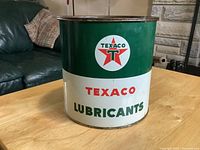 Front side of vintage Texaco lubricant grease can showing logo and branding.