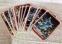 Group photo showing a fanned-out collection of mini posters featuring players of the 1982 Toronto Blue Jays in their blue uniforms with white-red borders.