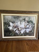 Frontal image of the framed floral artwork print showing white flowers and the ornate gold-tone frame