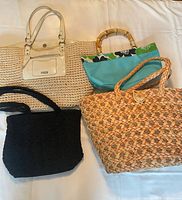 All four bags displayed on a flat surface showing different styles and colors.