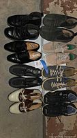 Eight pairs of men’s shoes arranged together