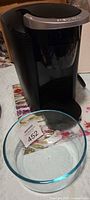 Keurig coffee maker with Pyrex bowl in foreground