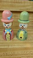 Front view of both Mom and Pop ceramic figure shakers