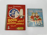 Front covers of two vintage children's books side by side: 'The Book About Moomin and Little My' and 'The Twins'.