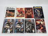 Photo showing all eight graphic novels including Illustration magazine and various comics