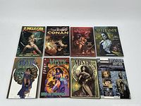 Top view of all 8 graphic novels arranged in two rows, titles visible.