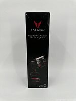 Front view of Coravin Model Two box showing brand and product image pouring wine.