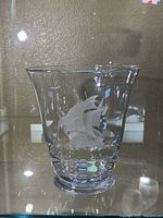 Full view of the large clear glass vase with frosted sailing ship image on its front and weighted bottom