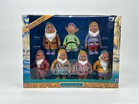 Front image of box containing seven Mattel Seven Dwarfs figures from Snow White collection, showing all figures in the packaging.
