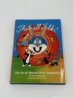 Front cover of the book featuring Bugs Bunny, Daffy Duck and other Warner Bros. characters with the title 'That's all Folks! The Art of Warner Bros. Animation'.