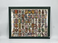 Full view of the framed print showing all vintage canned food and product logos arranged in rows.