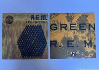 Photo showing both vinyl album covers side by side, 'Eponymous' on the left and 'Green' on the right.