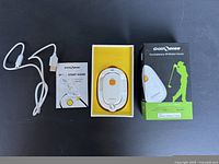 Complete Golfsense 3D Motion Sensor kit including device, charging cable, start guide, and box