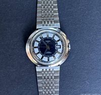 Close-up of the watch face showing the Timex Marlin dial with date window at 3 o'clock, stainless steel case and bezel.