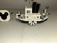 Overall view of the assembled LEGO Steamboat Willie model with its display plaque and Mickey Mouse minifigures.
