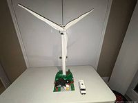 Full front view of assembled turbine with diorama base and van on table