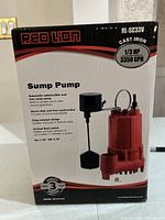 Front of the box showing model, power, material and flow rate of sump pump.