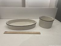 Photo showing the two serving dishes side by side with a ruler for scale on a white surface.