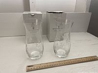 Both Royal Doulton glass vases shown with original packaging, ruler for scale, one box damaged.