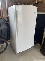 Full view of freezer in storage area showing overall exterior condition