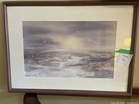 Framed watercolour seascape painting showing overall artwork and frame with visible matting and signature.