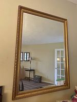 Full view of the large rectangular mirror showing its size and reflection in a room setup.