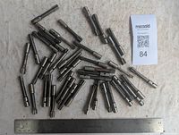 Close-up of several milling cutters showing different diameters and cutting teeth styles, with some visible use.