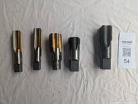 Overview of all 5 Vermont taps, showing two new and three used/modifed tools.