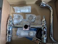 Chrome double-handle wall mount faucet with all components and hardware in box