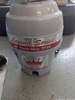Waste King 9940 Legend Series disposer unit in silver and white with branding