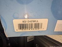 Close-up photo of the product box label with model number KS1342WLL and barcode.