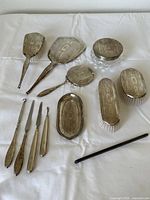 Overview of all 12 pieces laid out on white cloth