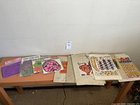 Full lot of vintage calendars, stickers and decorative paper on a bench